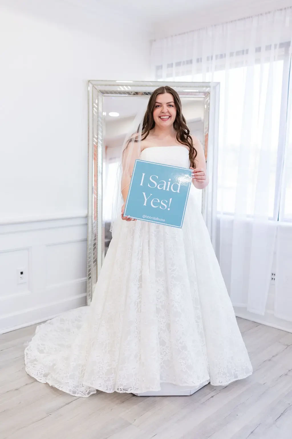 bride in wedding dress saying yes