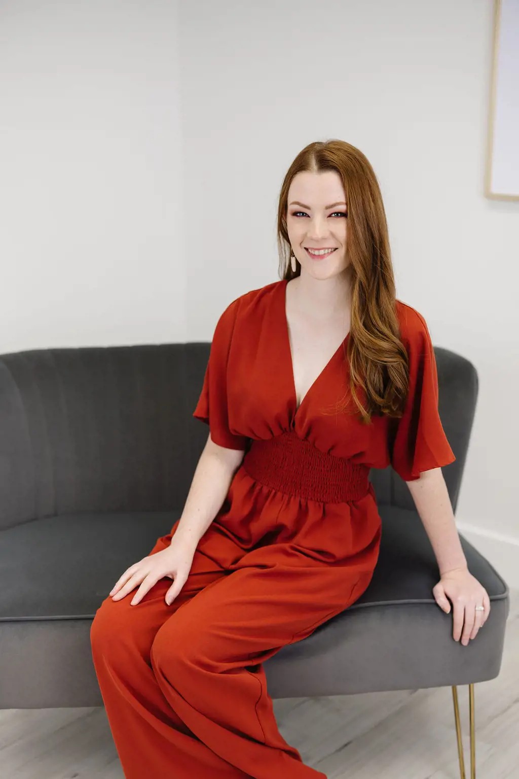 Bridal Stylist Brittany wearing a stripped black blouse and black pants