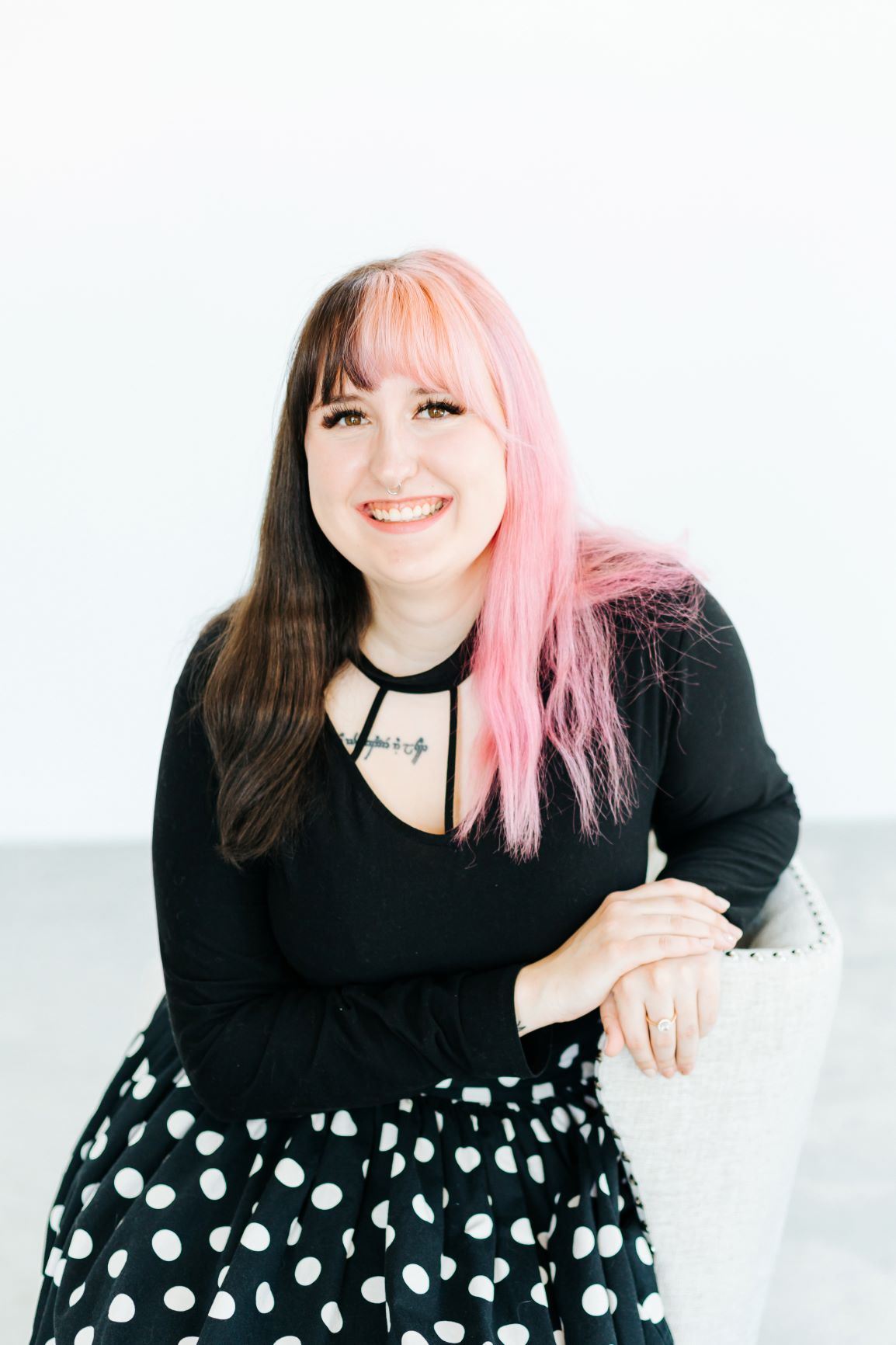 Bridal Stylist Sheila wearing a black blouse and polka dot skirt