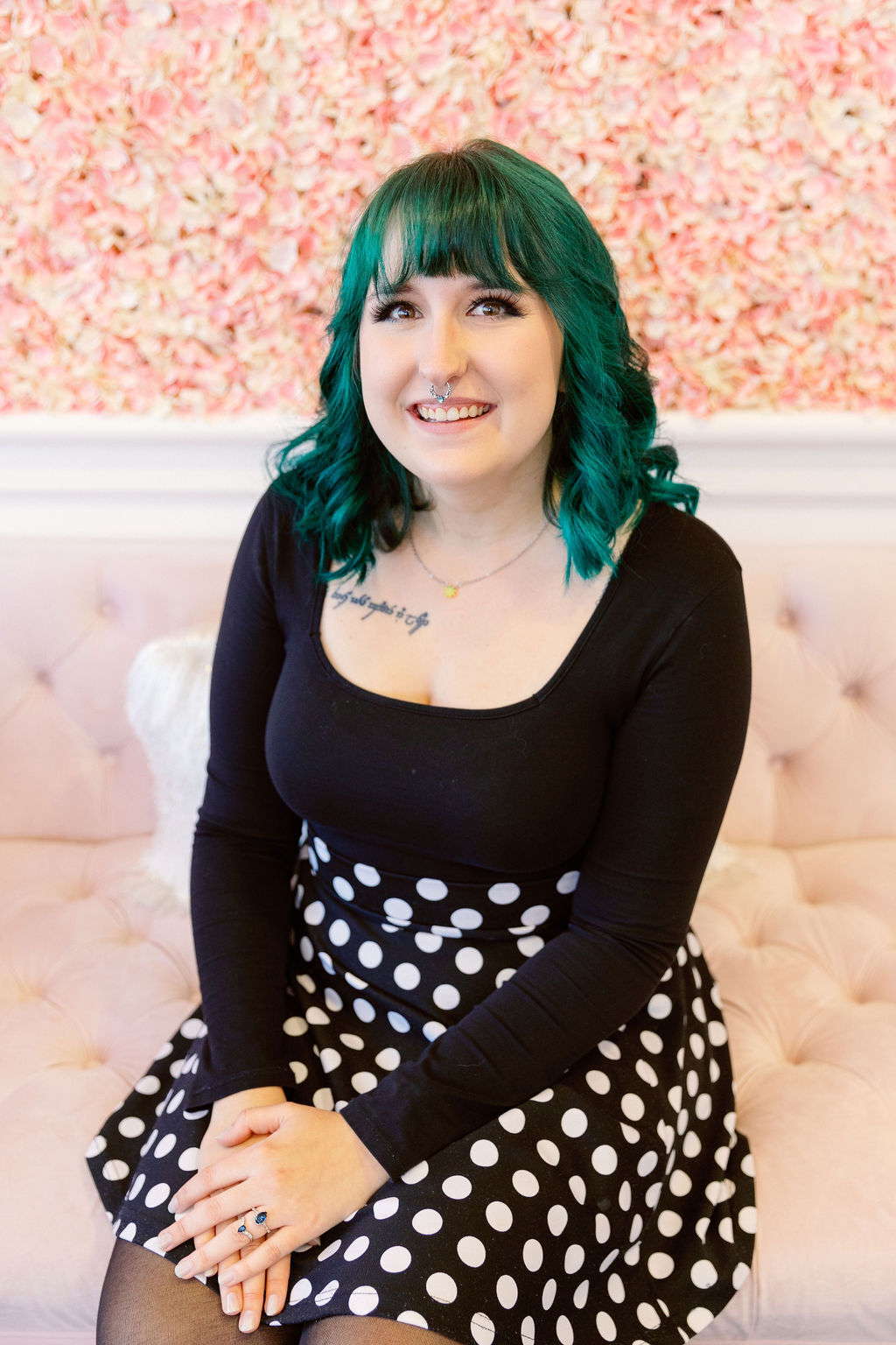 Bridal Stylist Sheila wearing a black blouse and polka dot skirt